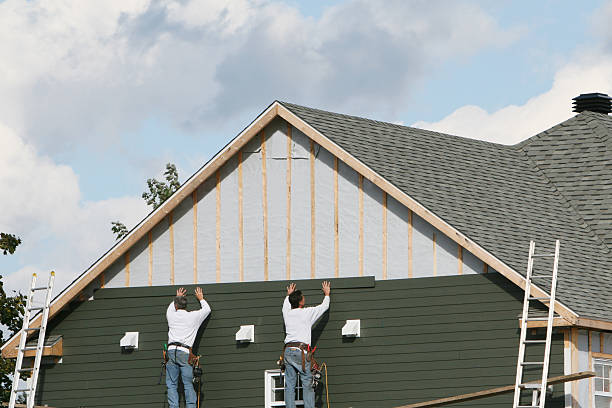 Professional Storm Damage Siding Repair technician working in Casstown, OH